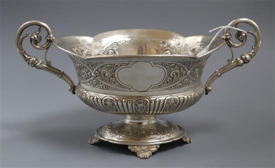A late Victorian embossed silver two-handled shaped oval bowl, London, 1900, 18.5 oz.
